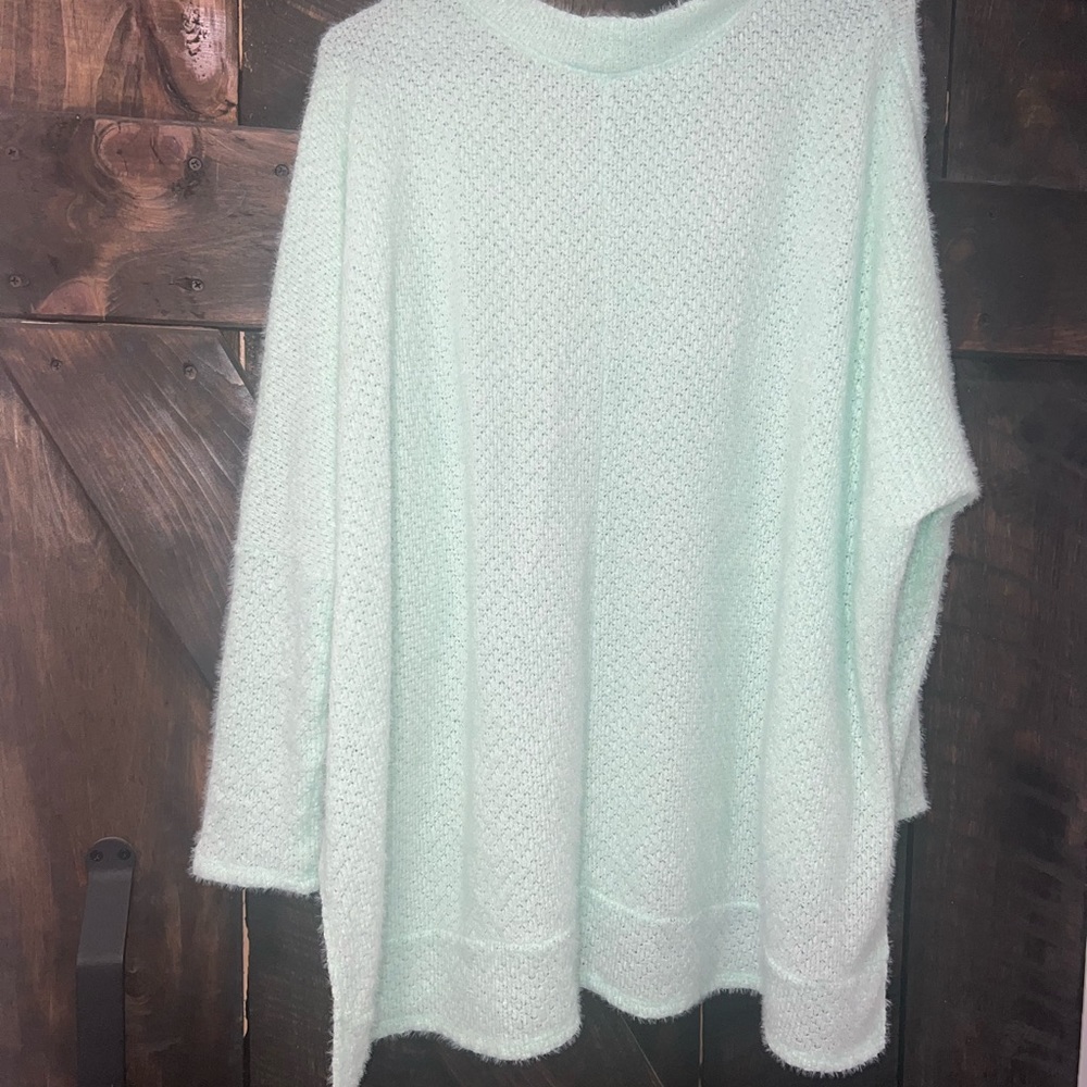 over sized pink lily sweater. never worn, perfect condition. mint green